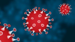 Virusdeeltje in rode kleur als symbool voor de invloed van je woning op je immuunsysteem